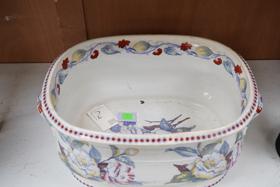 A 19th century Staffordshire pottery two handled footbath, (repaired), 50cm wide